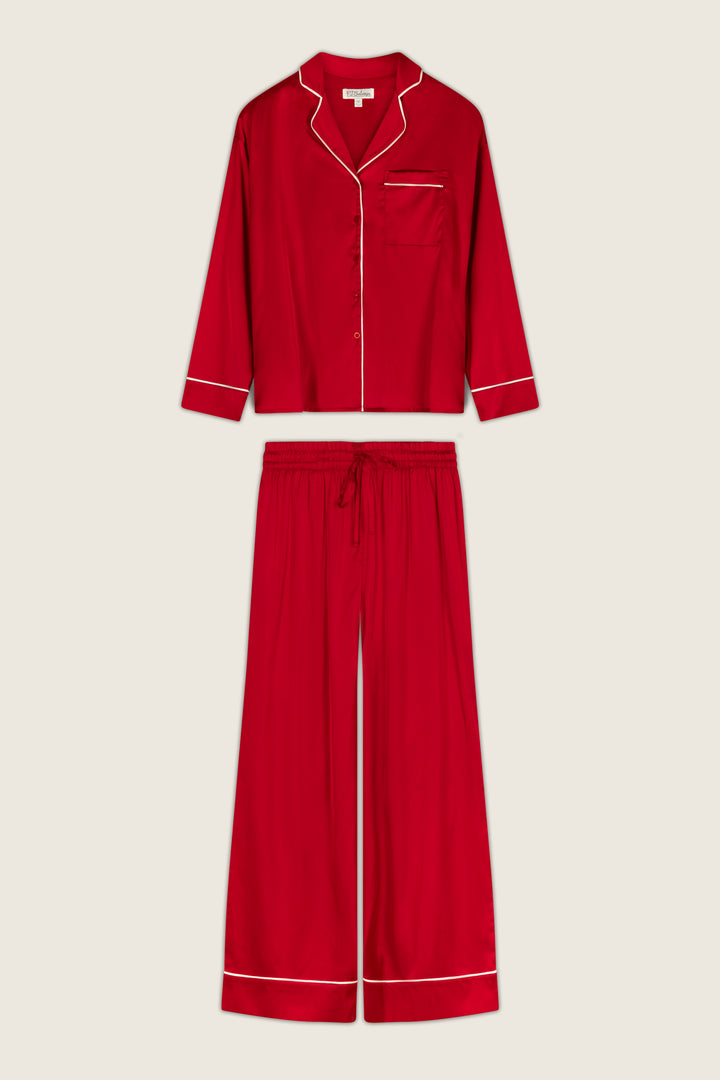 Moonlight Muse Red Satin Long Sleeve PJ Set consisting of a red long-sleeve button-down collared top and matching wide-leg trousers, both featuring white piping trim for a look of luxe loungewear.