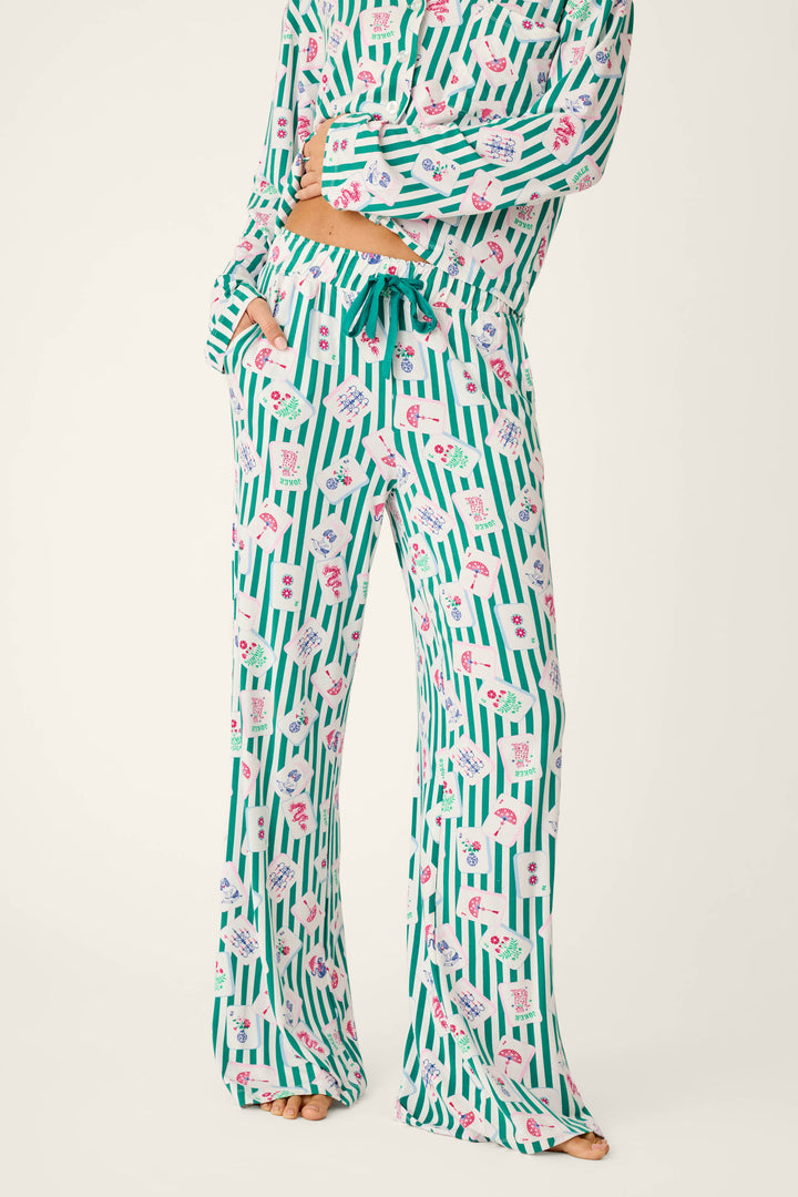 Mahjong Queen Dreams Pajama Pants featuring a white and green vertical stripe pattern with scattered Mahjong tile icons.