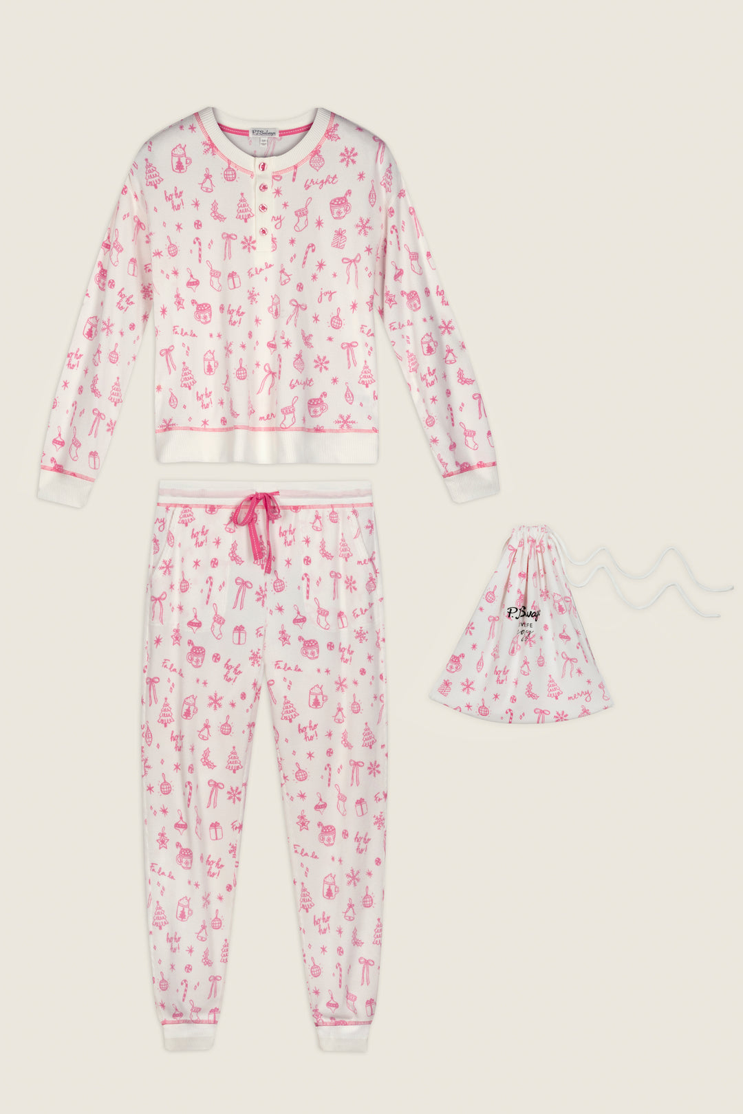 The Holiday Print 3-Piece PJ Gift Set by P.J. Salvage features a pink and white long-sleeve pajama top with playful holiday patterns, coordinating pants with a pink drawstring, and a matching small drawstring bag, all displayed on a plain background.