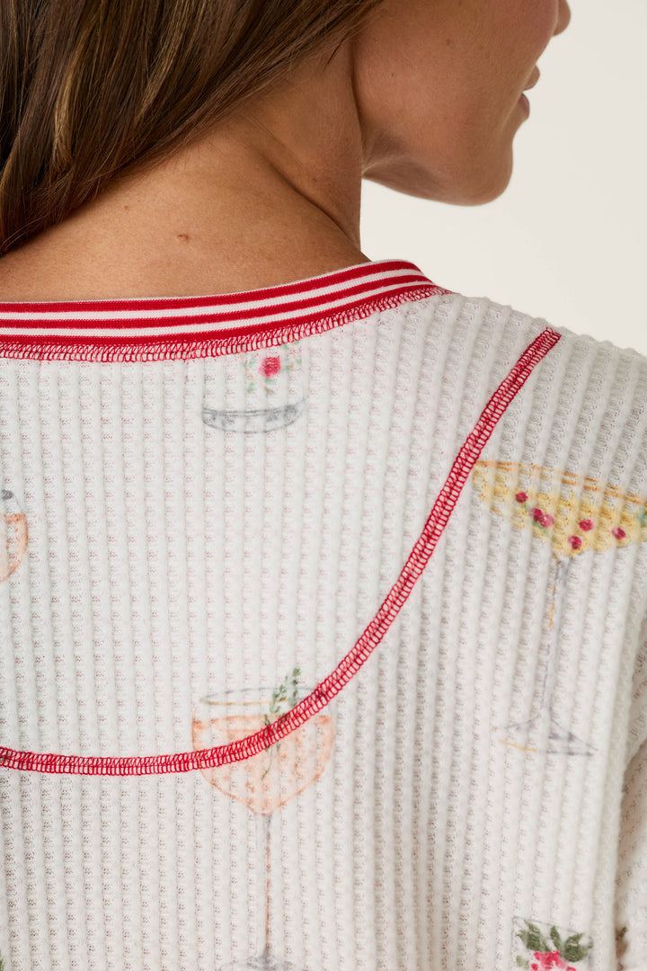 P.J. Salvage Ski Jammie Classics Cocktail Print Long Sleeve PJ Set, a white waffle-knit top featuring a cocktail print, red-and-white striped trim, and a cozy sleepwear design.