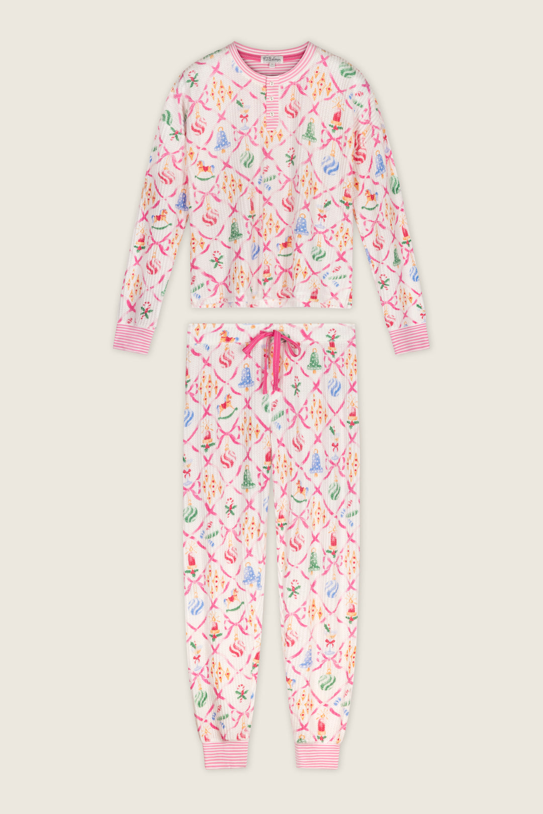 P.J. Salvage Ski Jammie Classics Ornament Print Long Sleeve PJ Set featuring a long-sleeve Henley top and matching joggers with a festive pink lattice pattern, colorful Christmas ornaments, and ribbons.