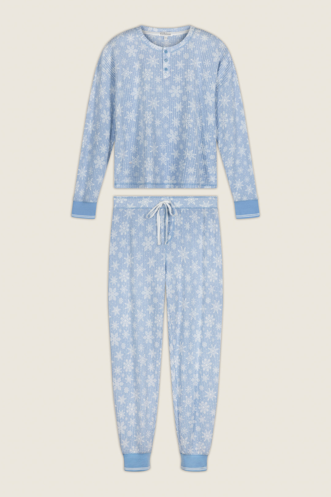P.J. Salvage Ski Jammie Classics Snowflake Print Long Sleeve PJ Set featuring a light blue brushed thermal henley top and matching jogger-style pants with a white snowflake print.