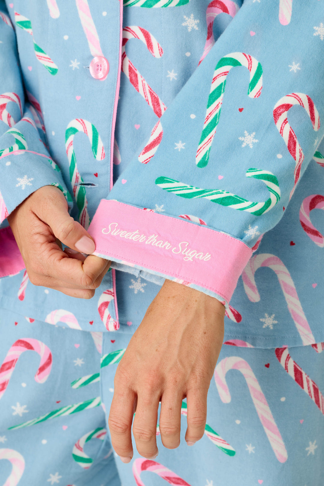 P.J. Salvage The Sweetest Season Candy Cane Print Flannel 3-Piece PJ Set: light blue flannel pajamas patterned with candy canes and snowflakes, featuring pink cuffs embroidered with the words Sweeter than Sugar.