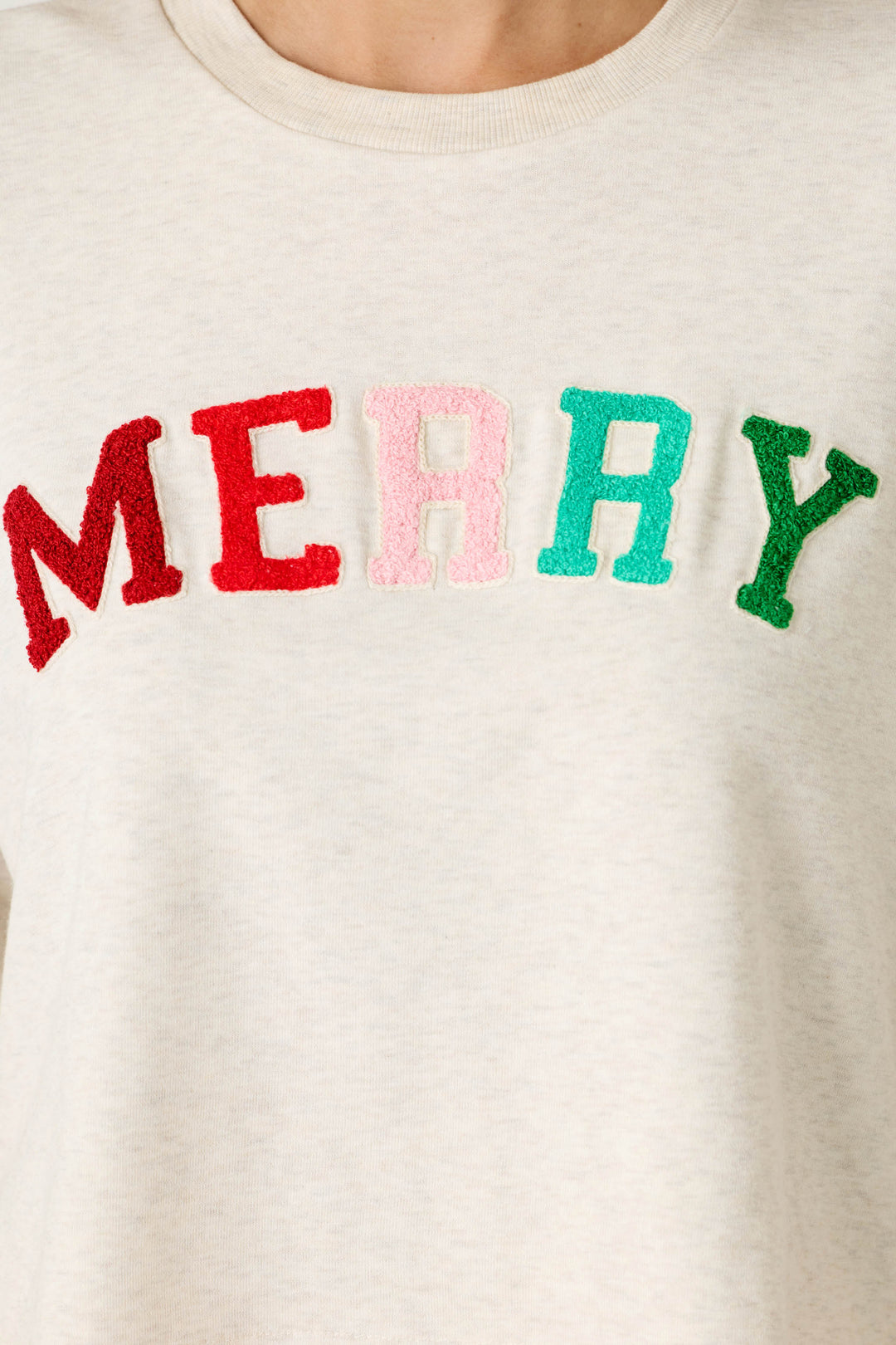 P.J. Salvage Very Merry Bouclé Merry Sweatshirt in cream fleece with MERRY embroidered across the chest in multi-colored, textured letters.