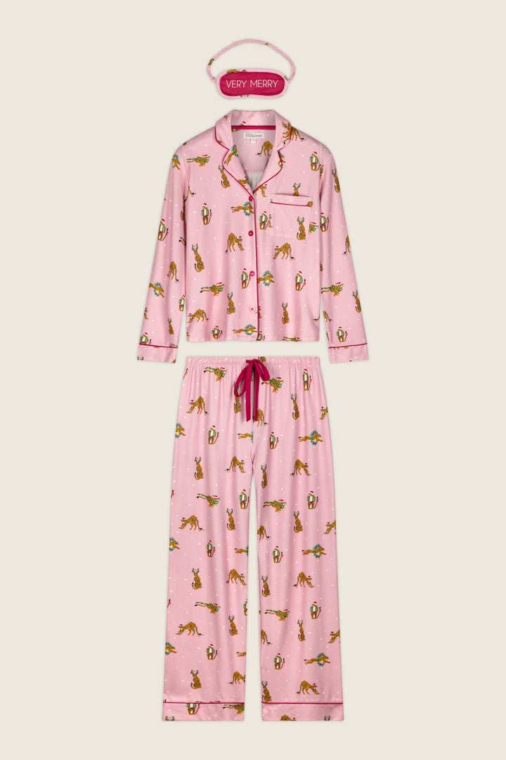 Very Merry Wild for the Holidays 3-Piece PJ Set: a pink long-sleeve button-down top, drawstring pants, and matching sleep mask with a holiday cheetah pattern and the text VERY MERRY.