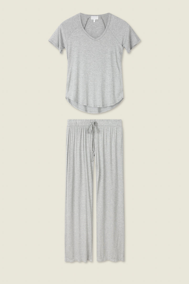 The Modal Basics Heather Grey PJ Set by P.J. Salvage includes a soft V-neck tee and tie-waist wide-leg pants in lightweight modal jersey, shown on a plain off-white background.