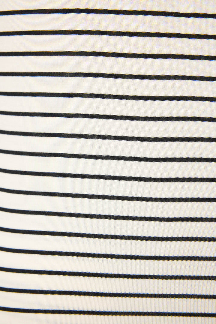 A close-up of the Modal Basics Striped PJ Set by P.J. Salvage highlights soft modal jersey fabric with evenly spaced black stripes on a white background, creating a timeless, classic striped look.