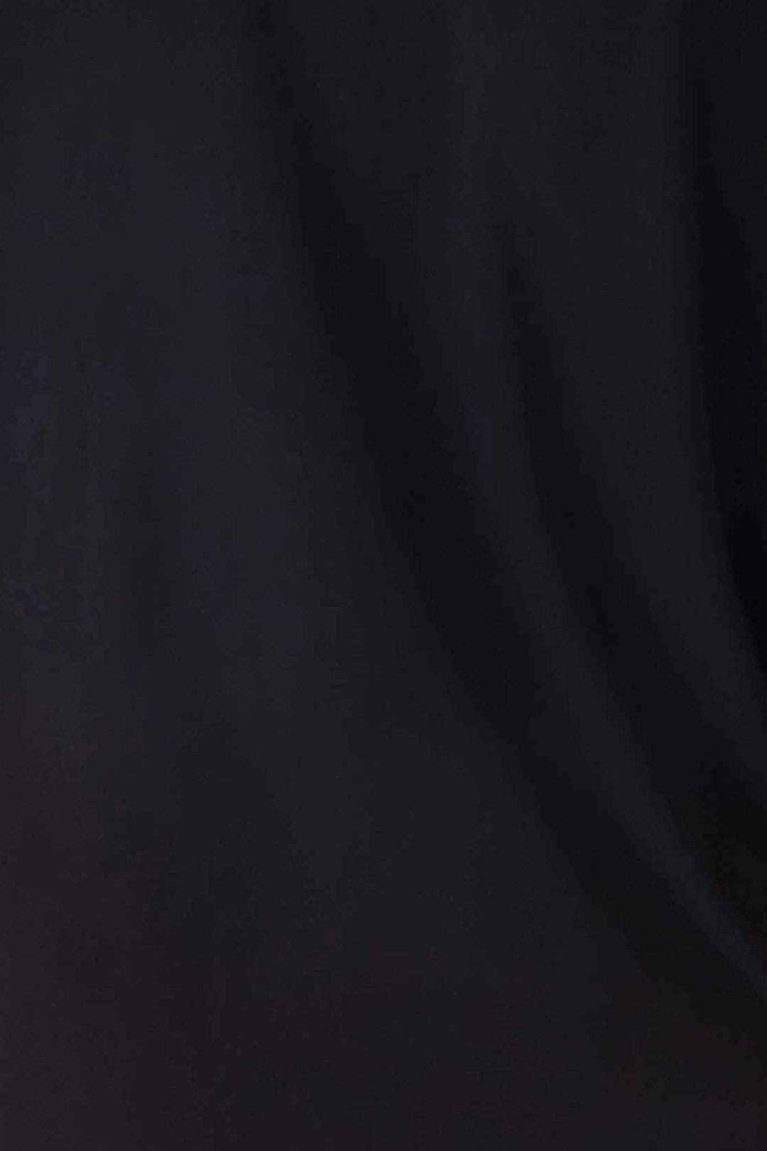 A close-up of the soft, black fabric of P.J. Salvage’s Jammie Essentials Black Shorts, showing subtle folds and shadows—ideal for your Final Sale picks.