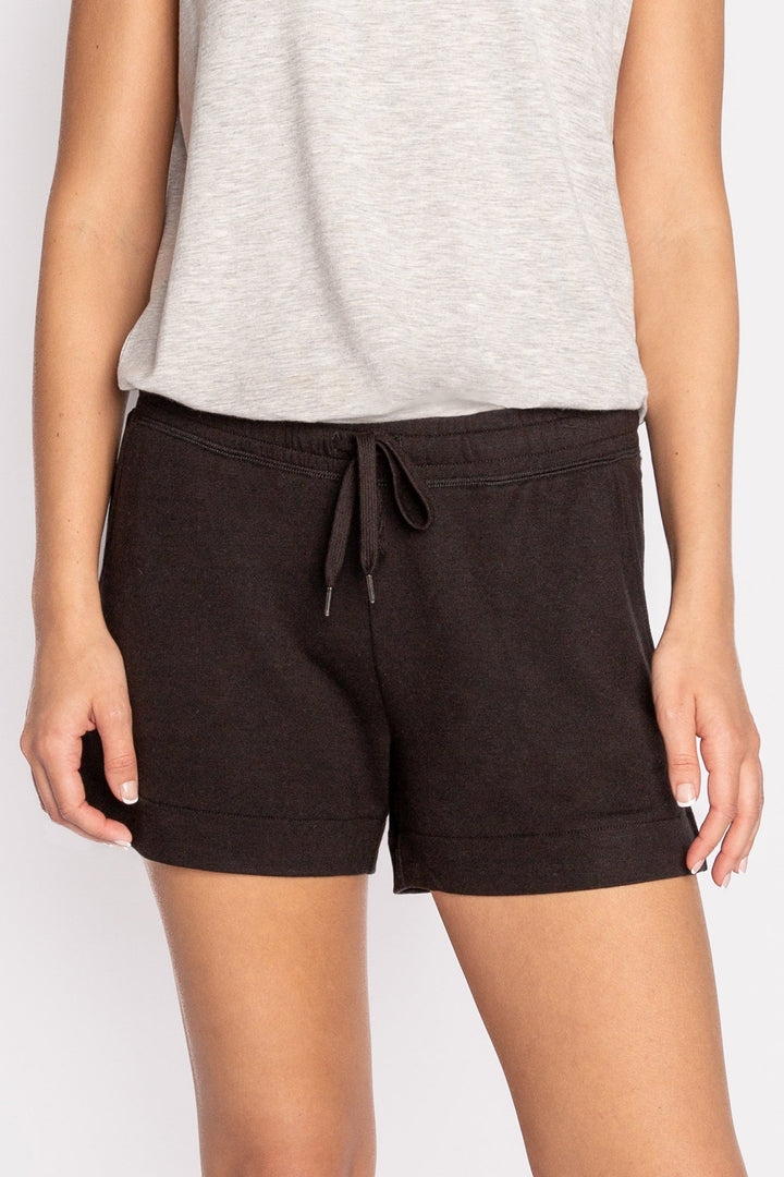 Black mini terry lounge shorts with side slit, tie waistband & pockets. (7122608521316)