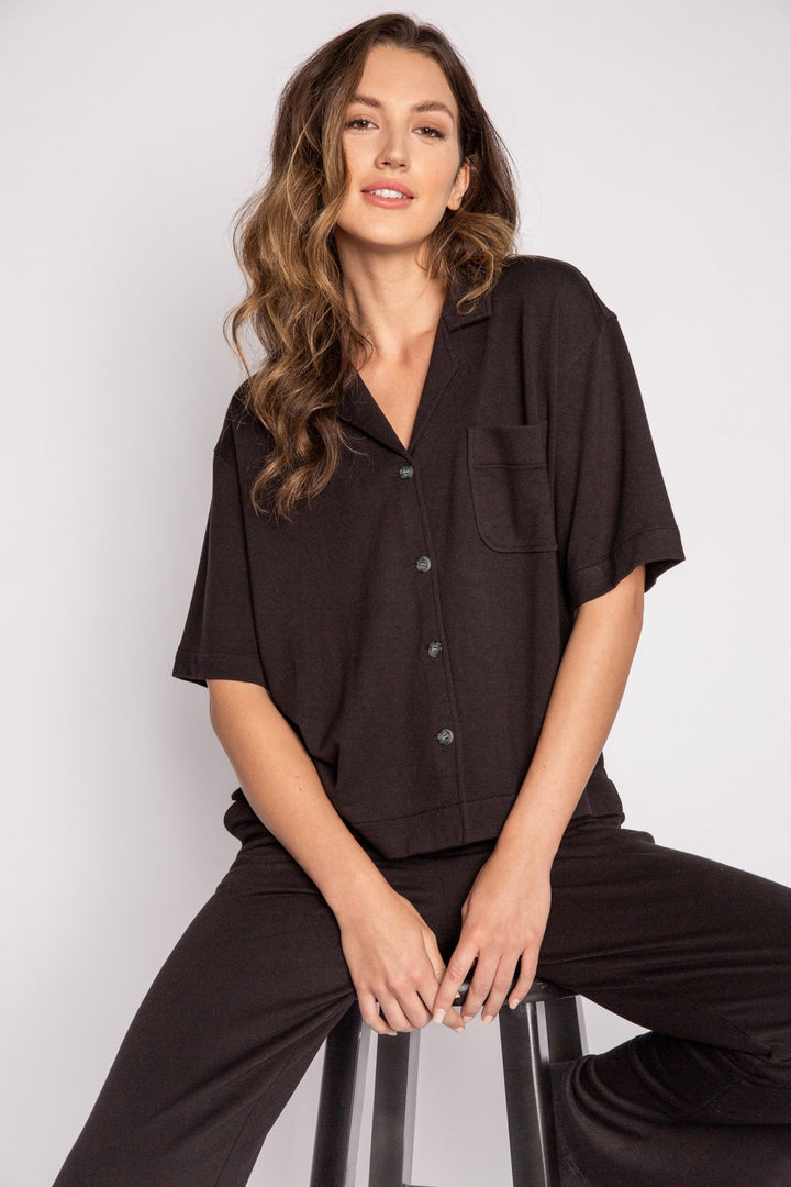 Black terry lounge set with short sleeve button-down top and tie waist pants. (7125203714148)