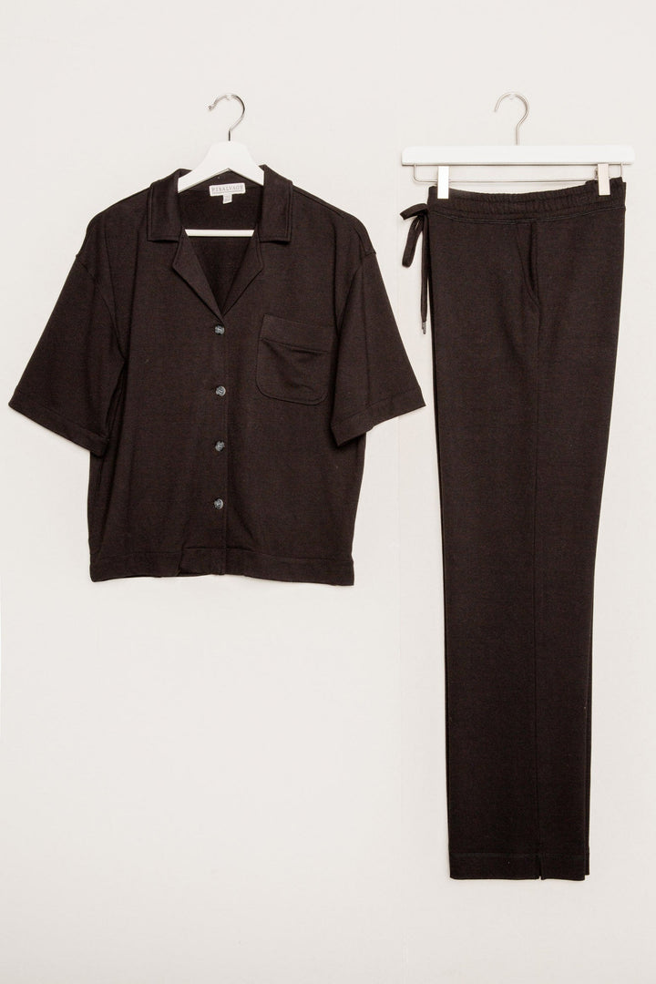 Black terry lounge set with short sleeve button-down top and tie waist pants. (7125203714148)