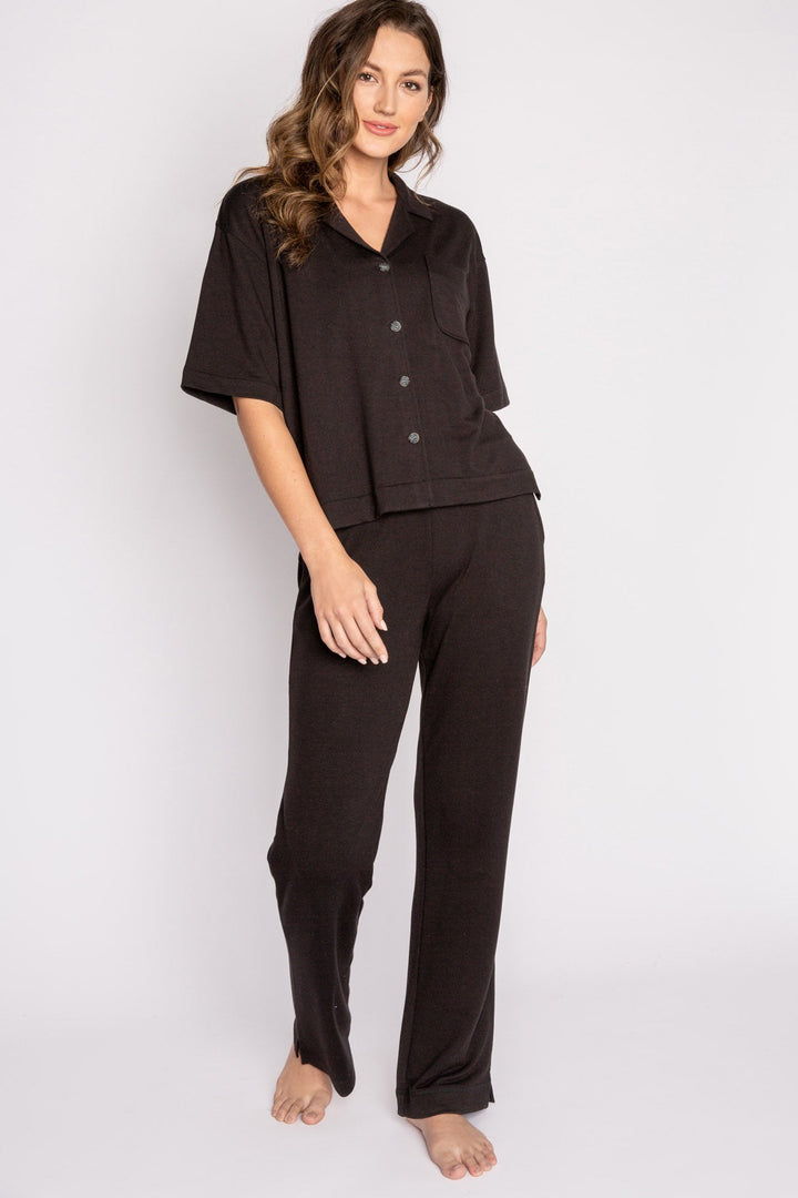 Black terry lounge set with short sleeve button-down top and tie waist pants. (7125203714148)