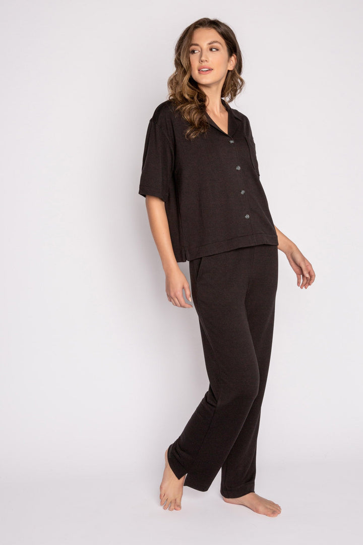 Black terry lounge set with short sleeve button-down top and tie waist pants. (7125203714148)
