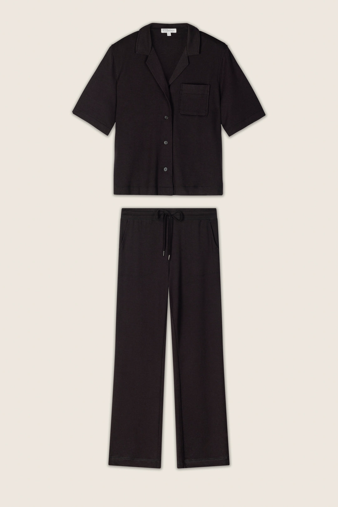 The black baby terry knit fabric has a soft, slightly textured appearance and is displayed on a neutral background.