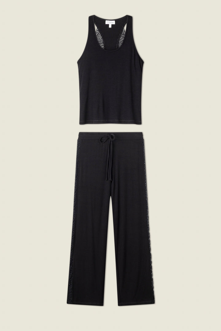 The Lacey Basics Black Lounge Set by P.J. Salvage is shown on a plain background, featuring a lace-trimmed tank top and wide-leg modal pants with subtle lace accents along the sides.