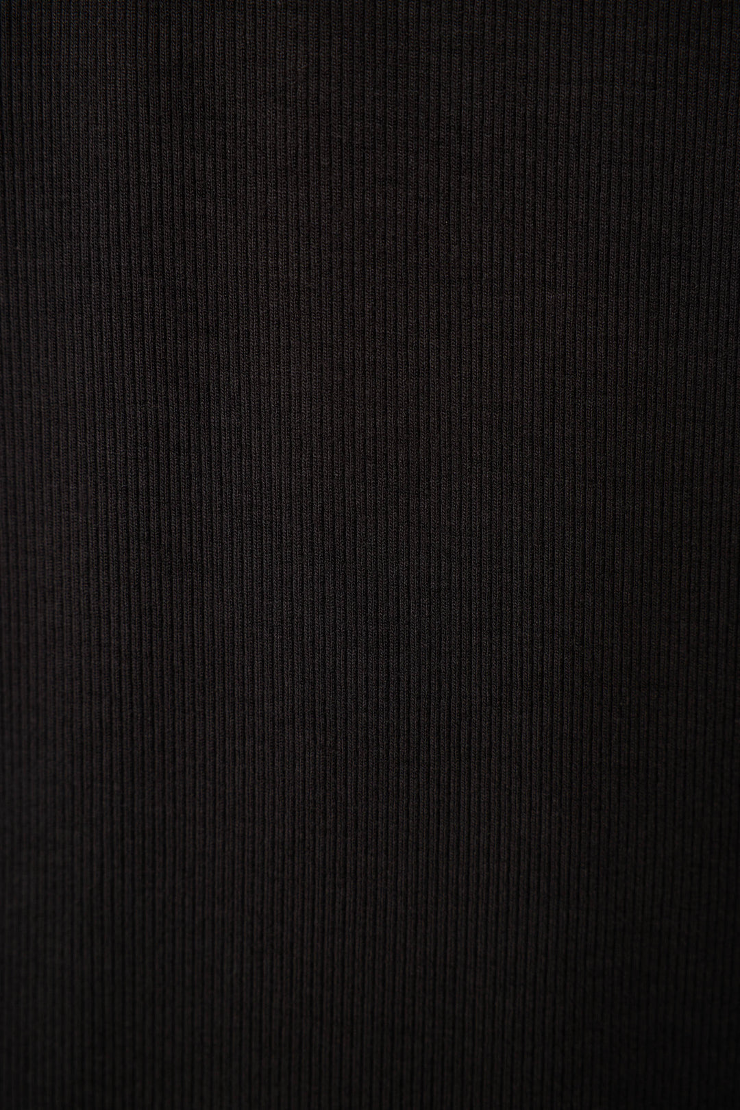 Close-up of the P.J. Salvage Lacey Basics Black Lounge Set, featuring a dark ribbed fabric surface with vertical textured lines for a soft, cozy feel.
