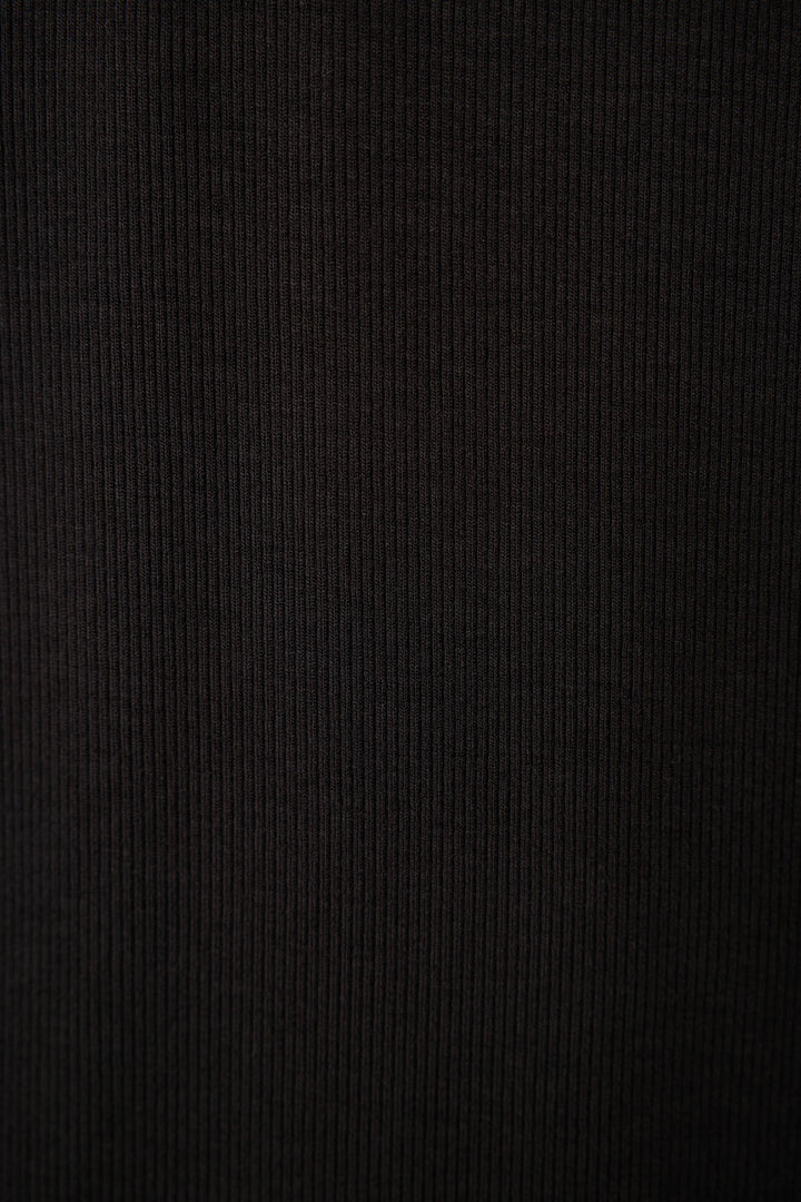 Close-up of the P.J. Salvage Lacey Basics Black Lounge Set, featuring a dark ribbed fabric surface with vertical textured lines for a soft, cozy feel.
