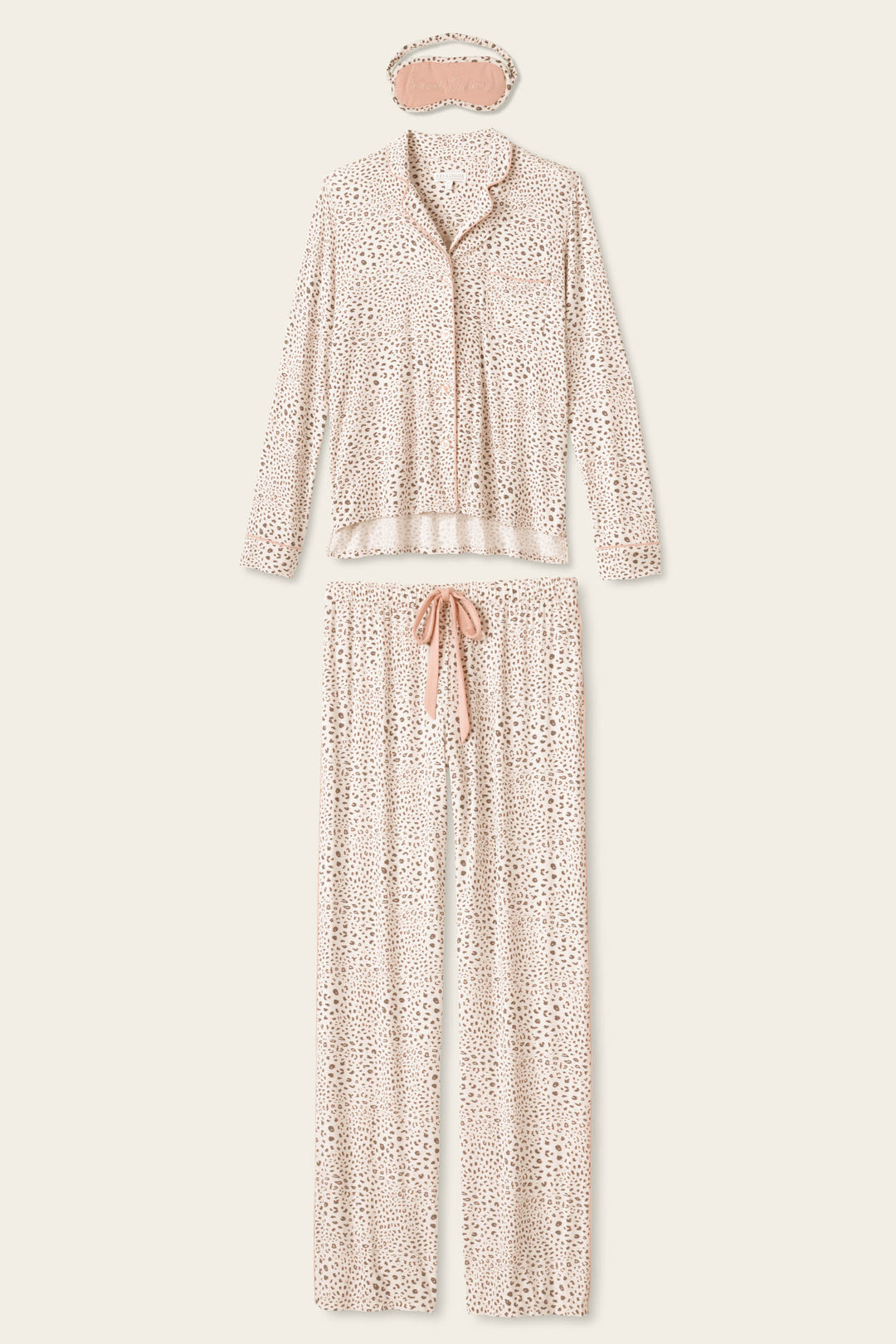 The Modal Dreams Leopard Print 3-Piece PJ Set by P.J. Salvage includes a soft modal jersey long-sleeve button-up top, drawstring pants, and a matching sleep mask in light beige with a small brown spotted pattern.
