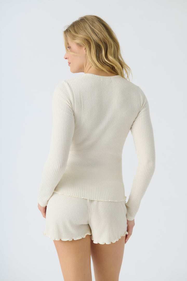 Women's ivory rib knit fitted long sleeve top & curly-edge hem