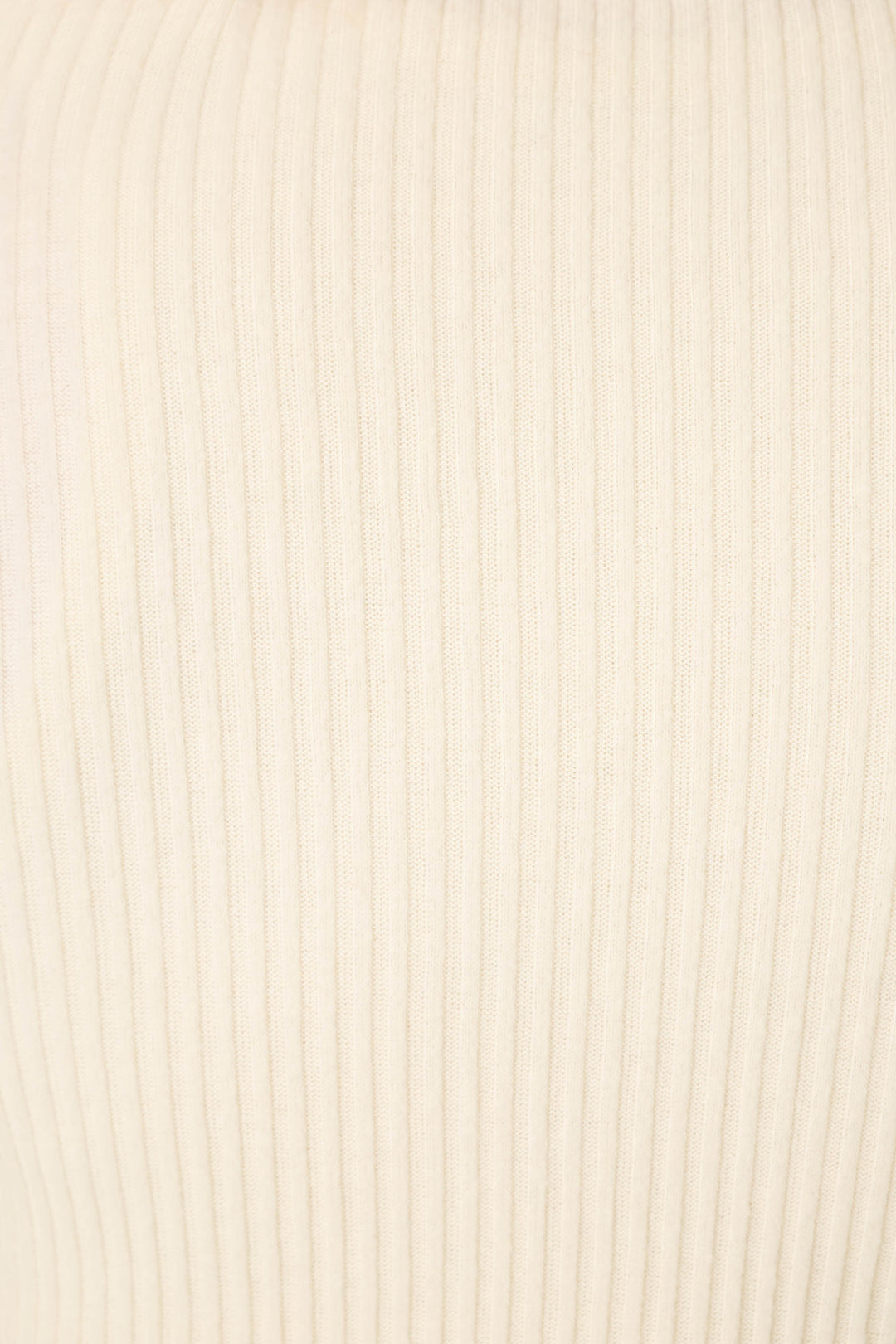 Close-up of the soft, light beige ribbed fabric featured in P.J. Salvage's Reloved Rib Natural 3-Piece Lounge Set, showcasing vertical textured lines and an evenly knit pattern ideal for comfy loungewear.