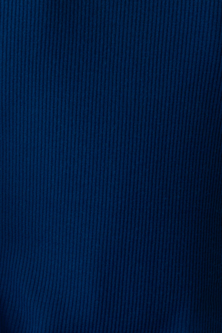 Navy V-neck top with relaxed fit in 2x2 peachy rib. Banded sleeve cuff & neck rib.