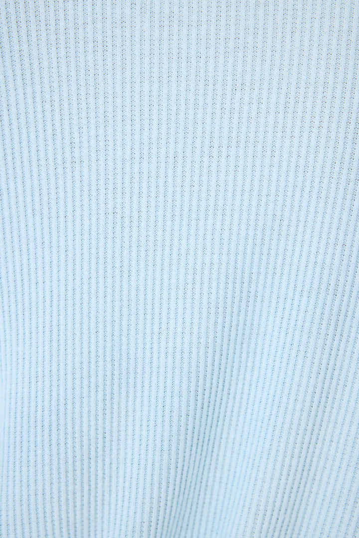 Close-up of the Textured Essentials Robe by P.J. Salvage, featuring a sky-blue cotton-blend jersey fabric with vertical ribbed texture and evenly spaced raised lines running parallel.