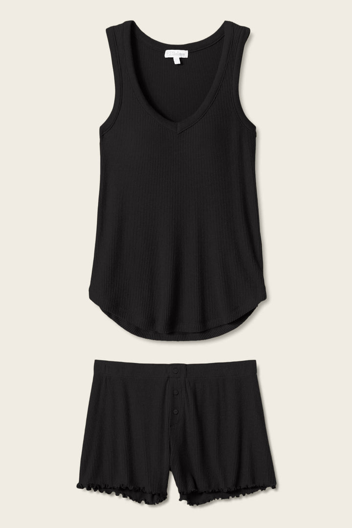 The Textured Essentials Black Short PJ Set by P.J. Salvage features a sleeveless V-neck tank and matching shorts with button details and ruffled hems, offering breathable comfort and shown flat on a light beige background.