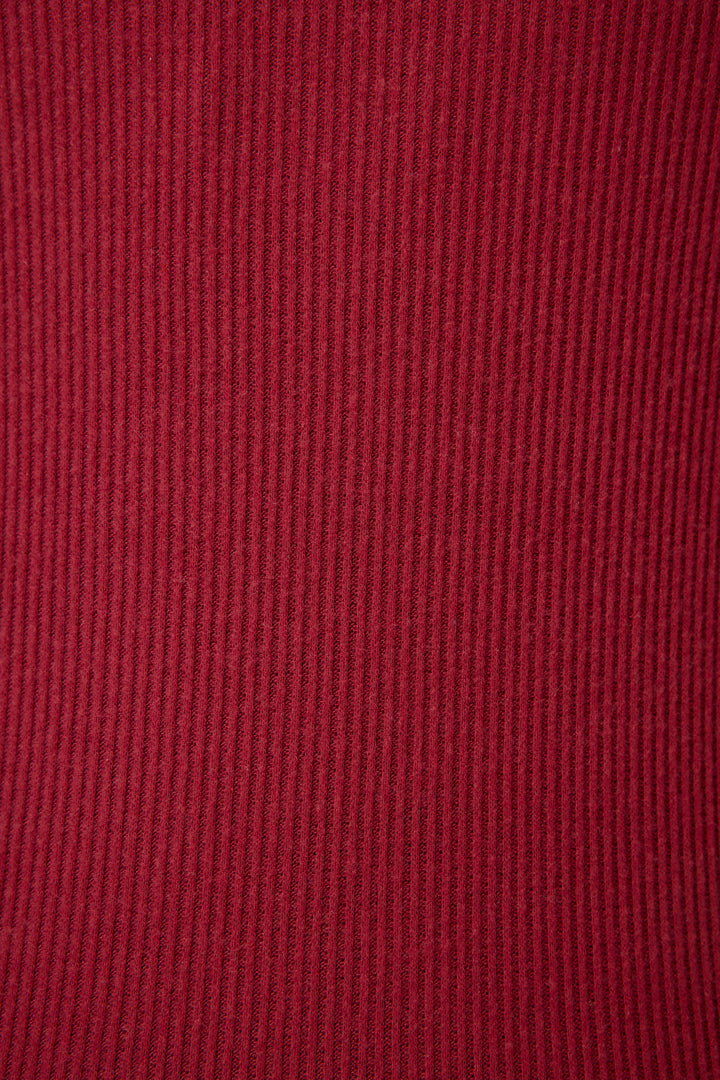 Close-up of P.J. Salvage’s Textured Essentials Short Set in deep red, featuring a ribbed fabric with vertical textured lines that create a uniform pattern and highlight the material’s weave.