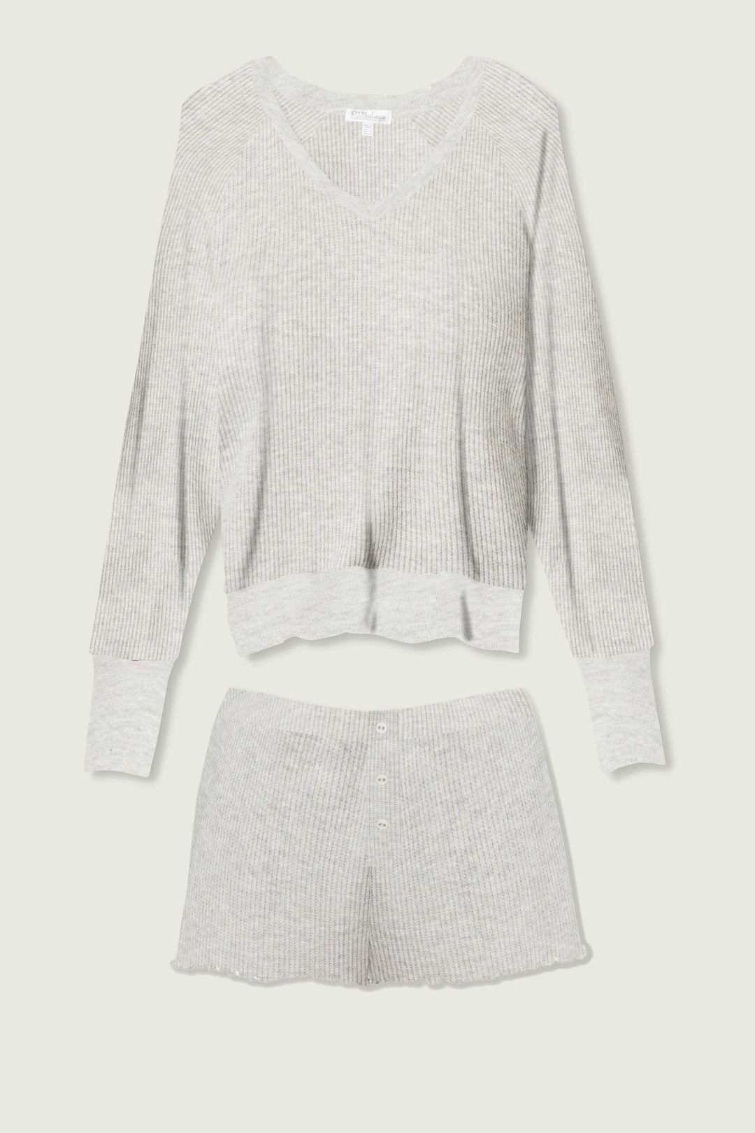 The P.J. Salvage Textured Essentials Heather Grey Short Lounge Set features a light gray ribbed knit, with a long-sleeve V-neck top and button-detailed shorts, shown laid flat on a light background.