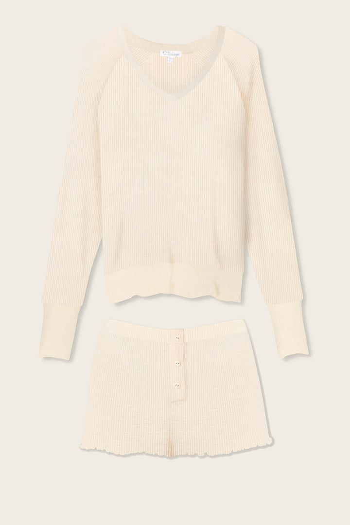 The P.J. Salvage Textured Essentials Stone Short Lounge Set features a cream ribbed knit V-neck long-sleeve top and button-front shorts, displayed flat on a light background.