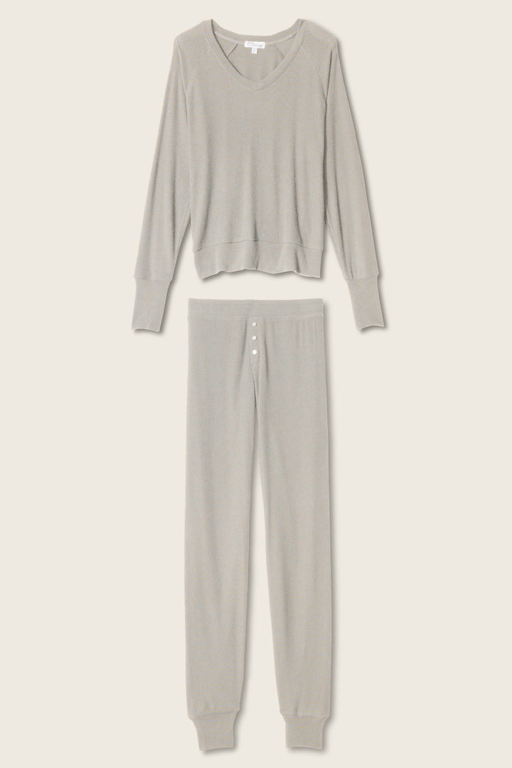 P.J. Salvage Textured Essentials Heather Grey Long PJ Set features a light gray ultra-soft jersey, with a relaxed-fit, round-neck long-sleeve top and matching button-front pants with cuffed ankles, displayed on a neutral background.