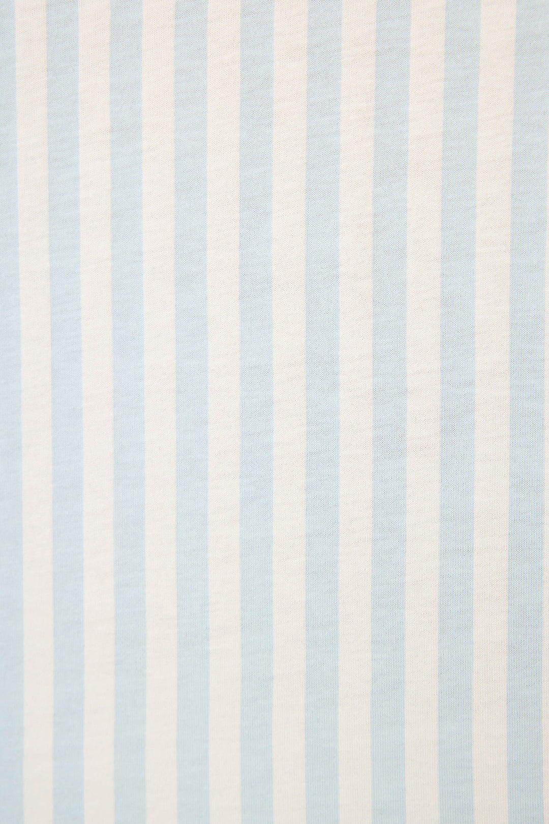 The Blue Stripe PJ Set from P.J. Salvage features light blue and white vertical stripes, evenly spaced on fabric with a visible texture.