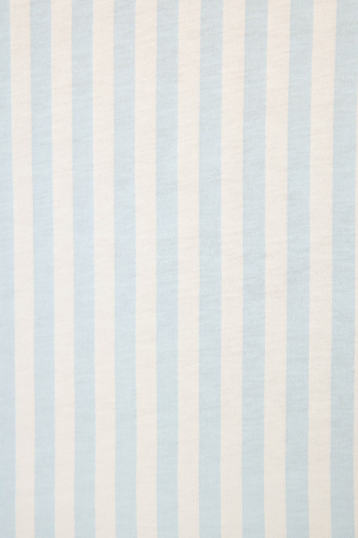 The Blue Stripe PJ Set from P.J. Salvage features light blue and white vertical stripes, evenly spaced on fabric with a visible texture.