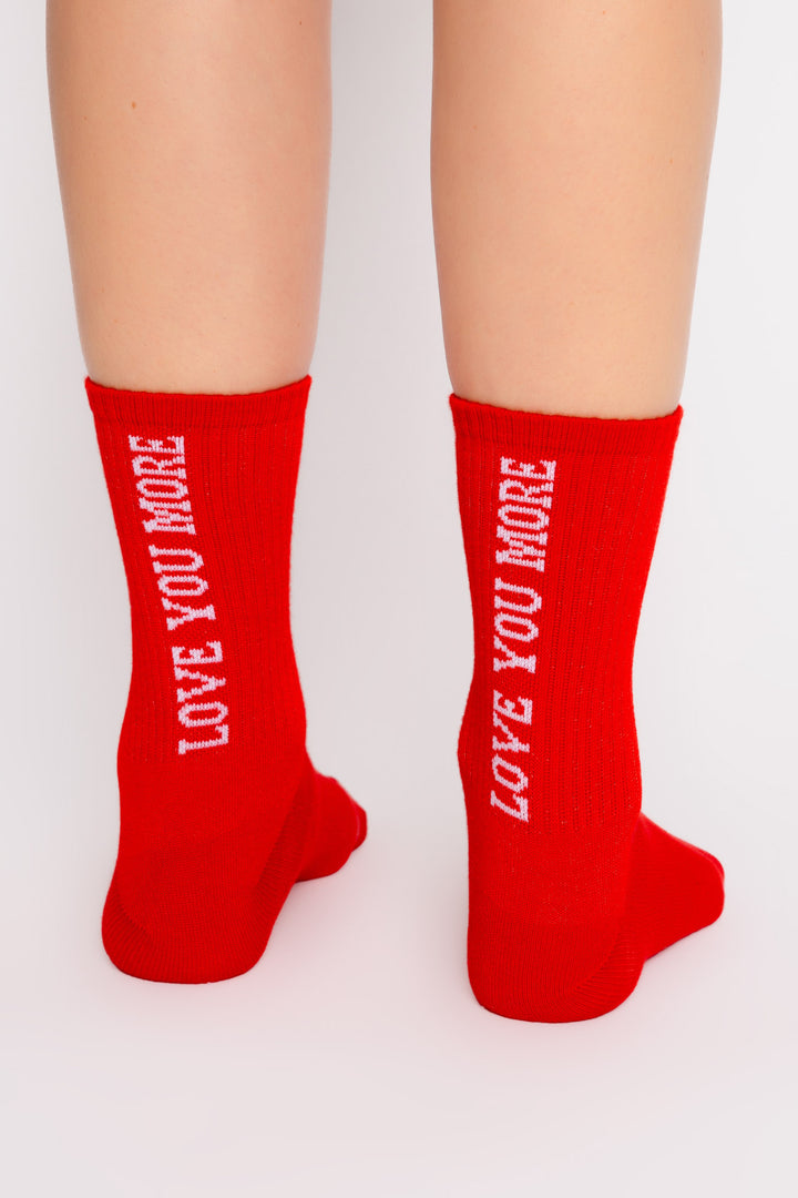 Red ribbed cozy socks LOVE YOU MORE printed on back of socks. Gripper print on soles for non-skid. (7325666213988)