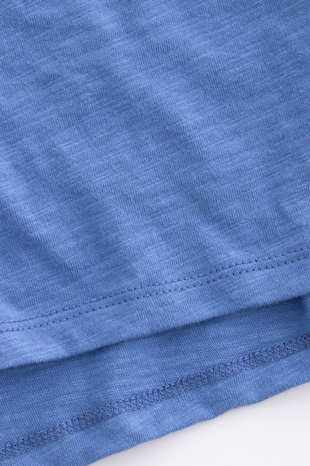 Navy blue cotton-blend short sleeve t-shirt with multi-color whipstitching at sleeves.