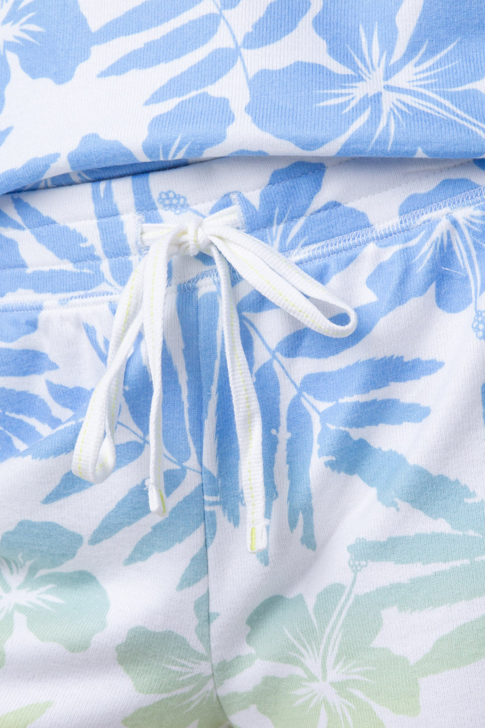 Women's lounge short in ivory-blue-green tropical print with tie waist.