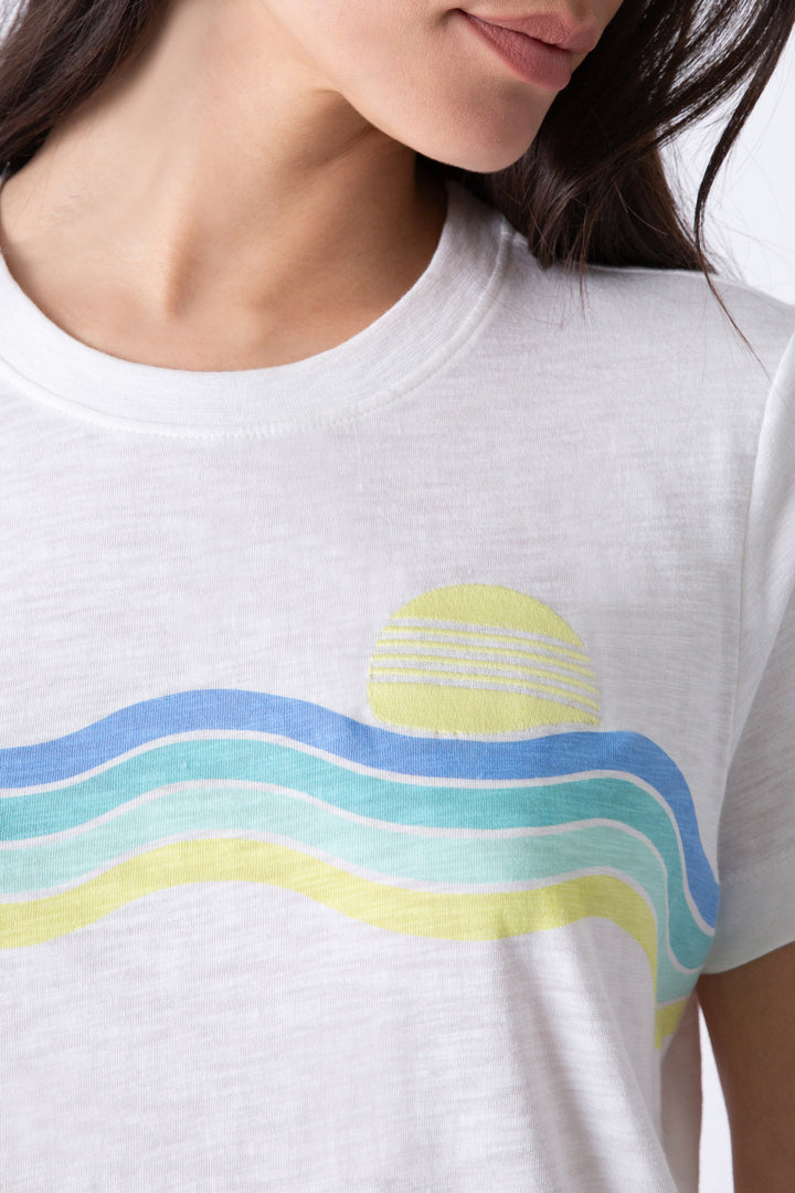 Women's ivory t-shirt with ocean & sun embroidered & print graphic on chest.