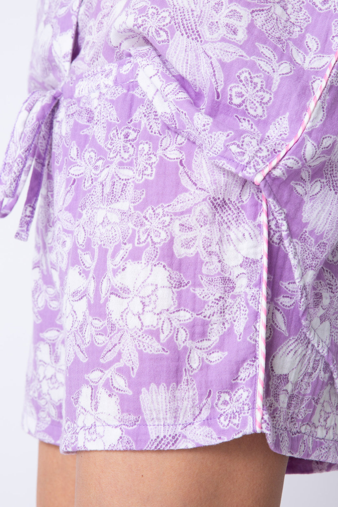 Cotton gauze women's lounge short in pale purple floral. Te waist.