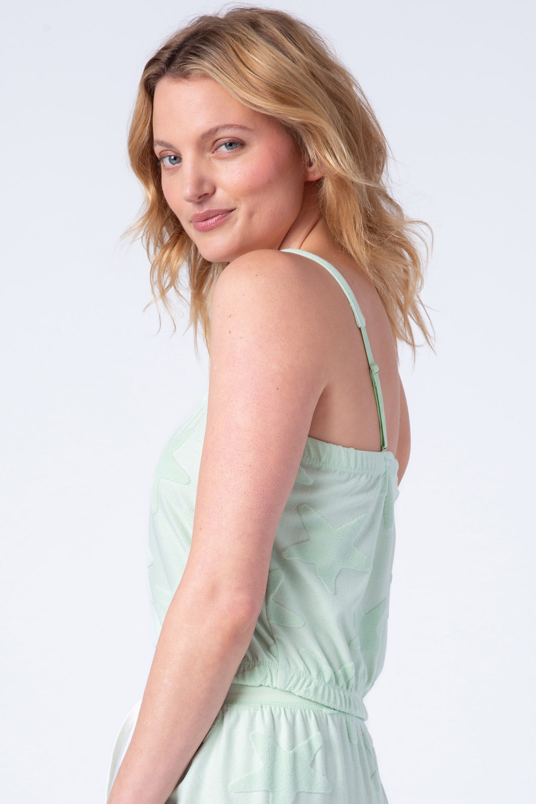 Women's cami tank with removable straps in green jacquard terry knit. Elasticized waist & chest.