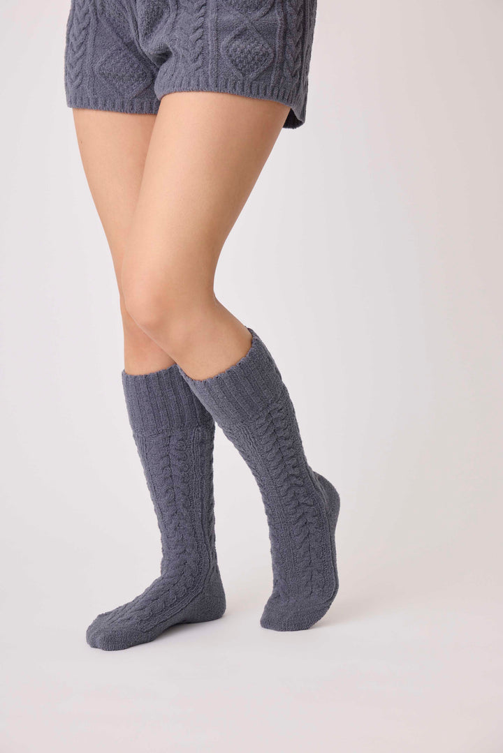 Women's cable texture cozy socks in charcoal grey. Non-skid grippers on soles.
