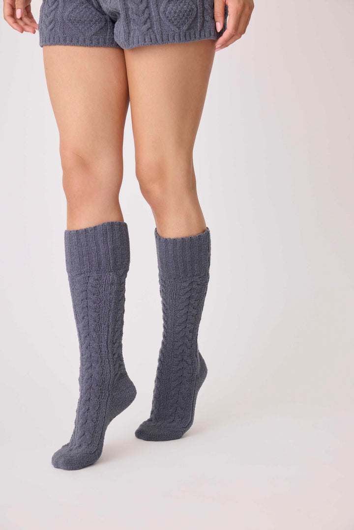 Women's cable texture cozy socks in charcoal grey. Non-skid grippers on soles.