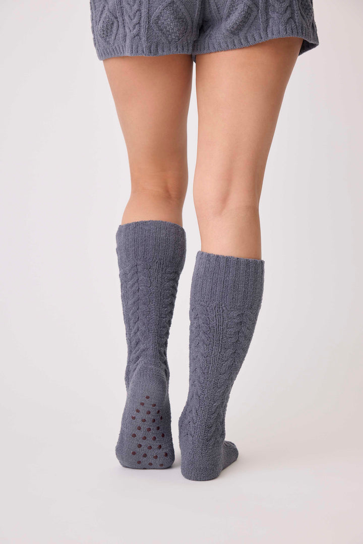 Women's cable texture cozy socks in charcoal grey. Non-skid grippers on soles.