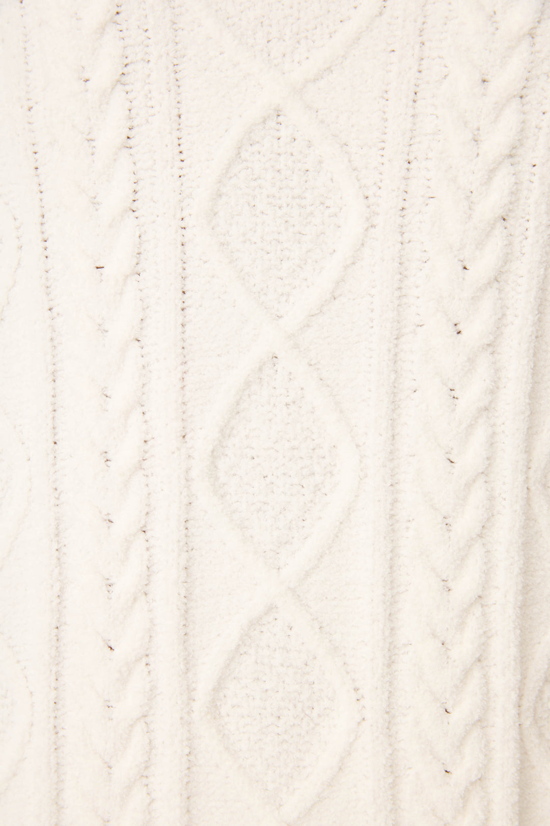 Close-up of the PJ SET CABLE CREW LOUNGE by P.J. Salvage, featuring a white knitted fabric with a textured cable and diamond pattern design.