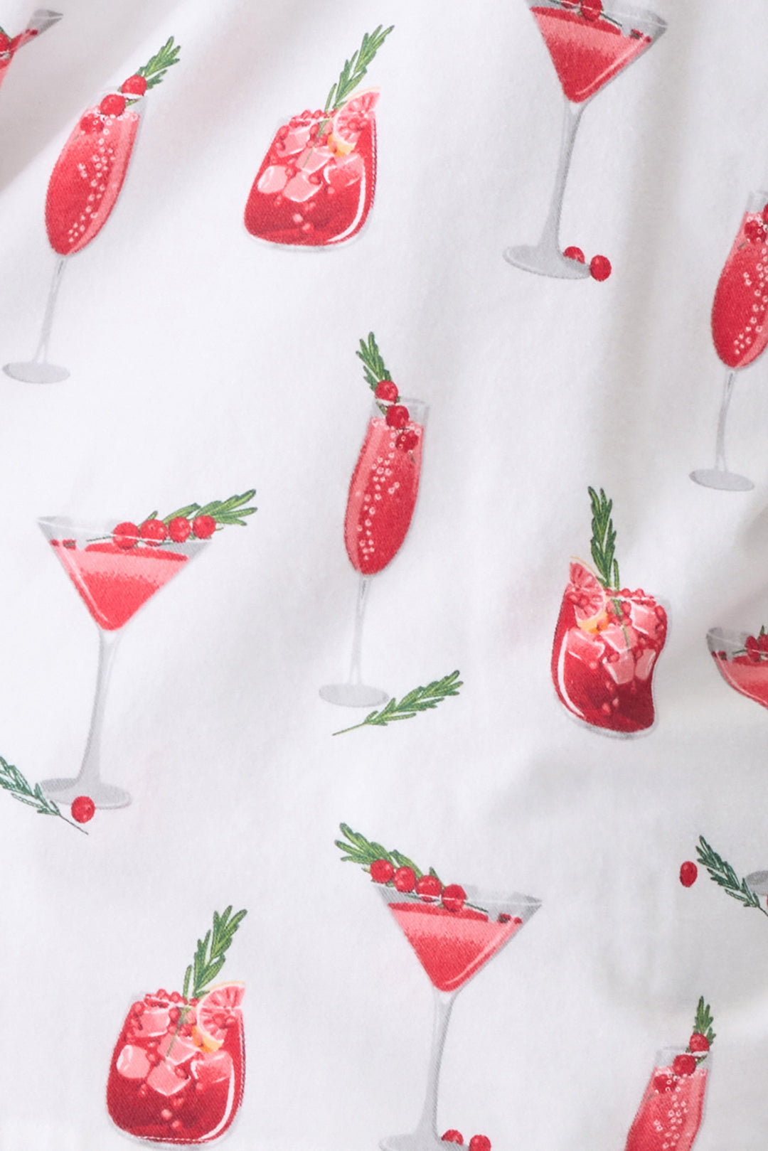 Women's cotton flannel pajama set in ivory & festive red cocktail print. Button-front collared top & tie-waist pant. Embroidered sleeve cuff "Warm Wishes & Cocktail Kisses". Includes matching hair wrap.