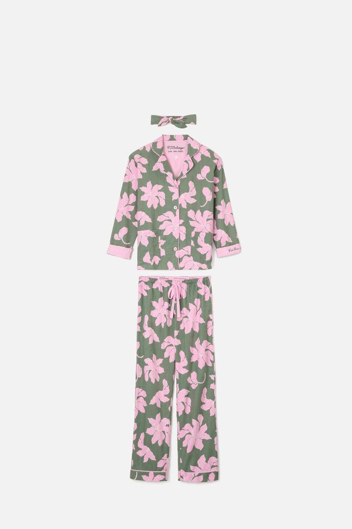Women's cotton flannel pajama set in green & pink poinsettia print. Button-front collared top & tie-waist pant. Embroidered sleeve cuff "Find Peace Within". Includes matching hair wrap.