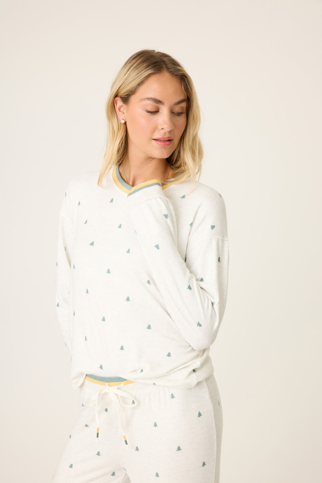 Women's long sleeve heather grey lounge top with mini tree print. Striped sleeve cuffs & open hem