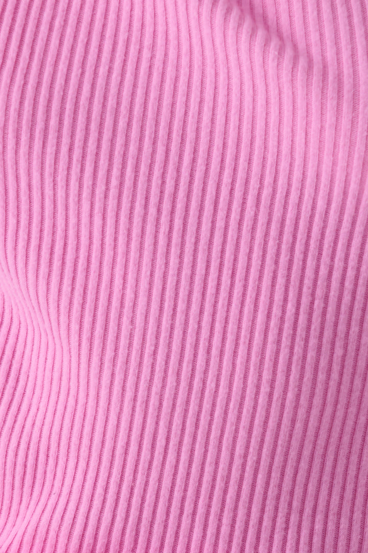 Pink fitted long sleeve rib top in Repreve x Reloved recycled soft knit with merrow stitched hem.