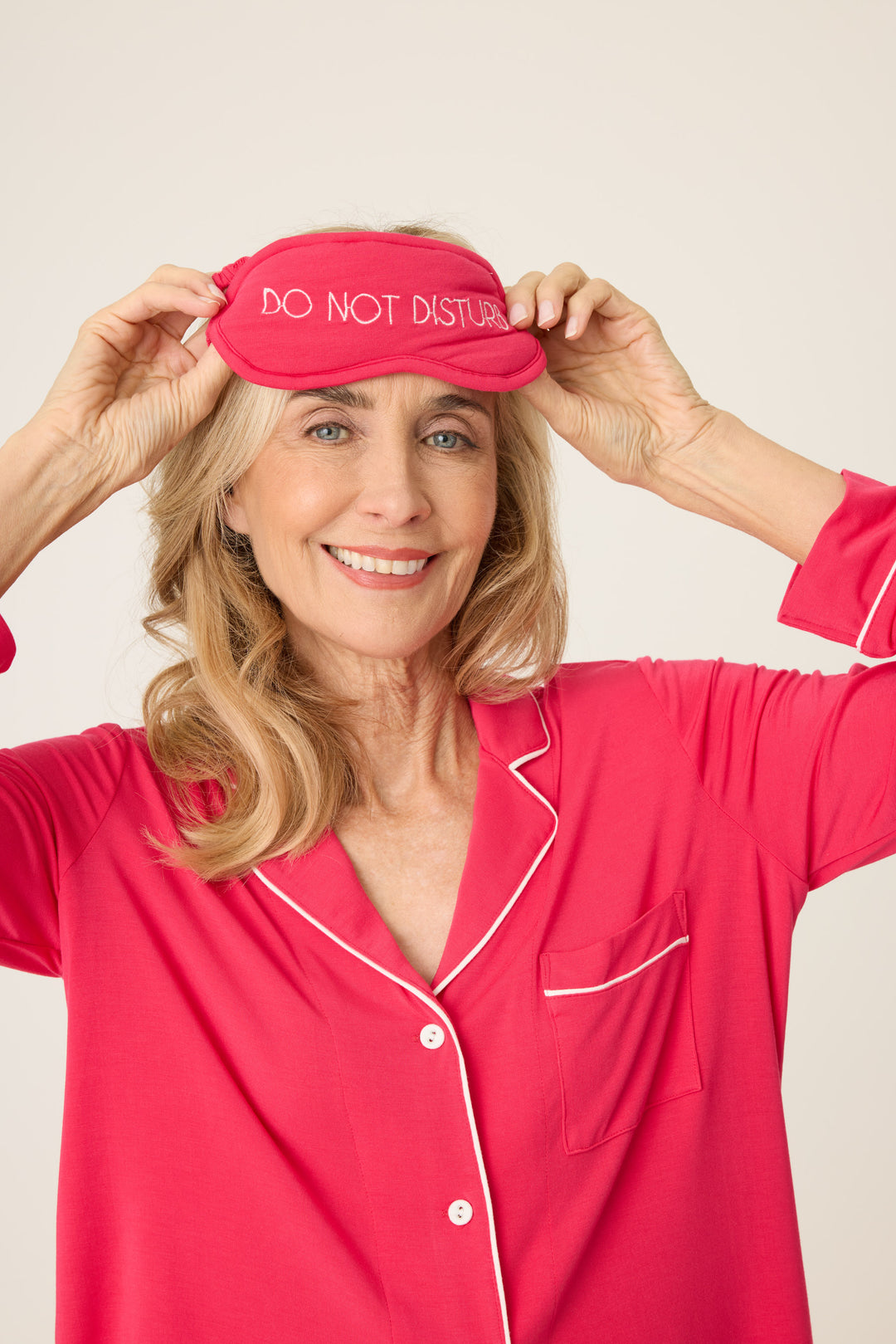 Women's hot pink collared pj top and tie waist pants with matching sleep eye mask.