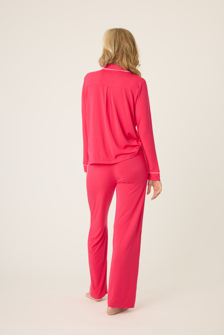 Women's hot pink collared pj top and tie waist pants with matching sleep eye mask.