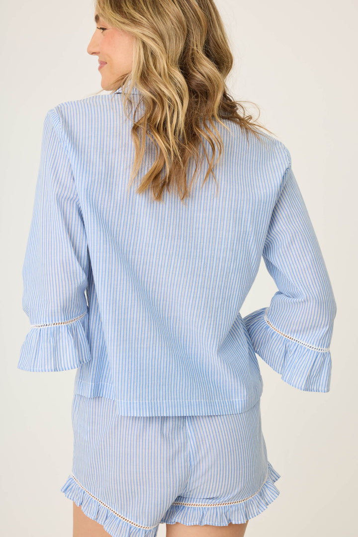 Women's blue & white striped cotton shirt with 3/4 ruffle sleeve. Collar & button-front. Waist length in lightweight woven.